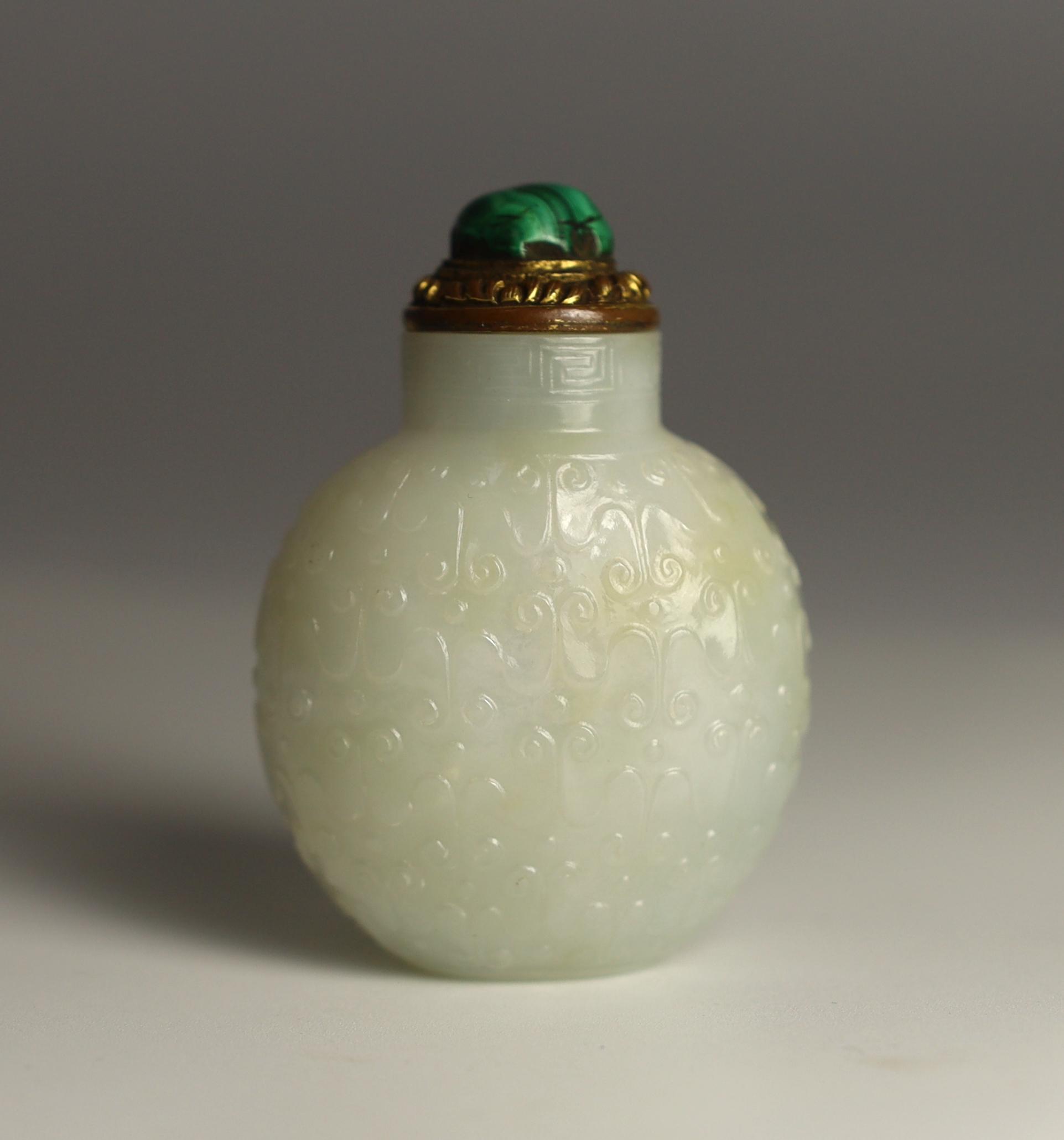 A good Chinese archaistic white jade snuff bottle, 1780-1850